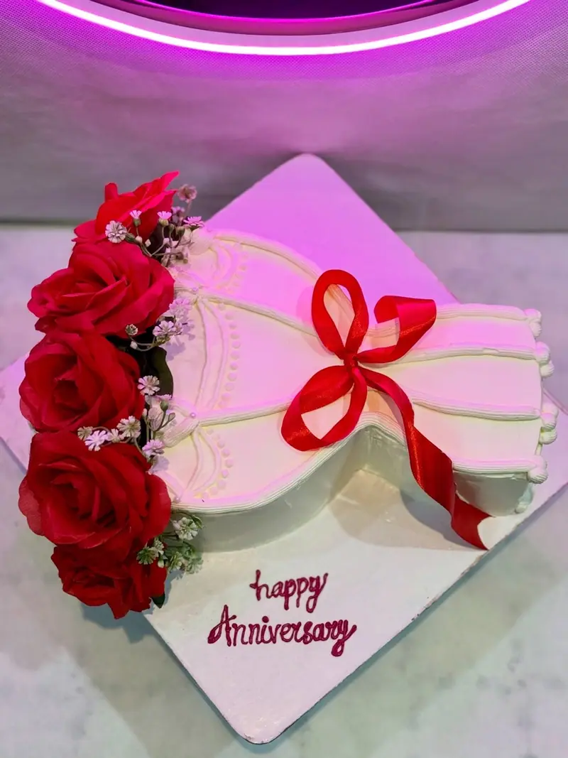 Anniversary cake decorated with red roses