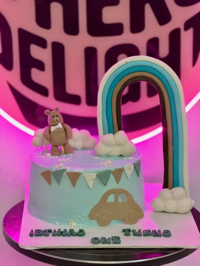 Rainbow and teddy cloud first birthday cake